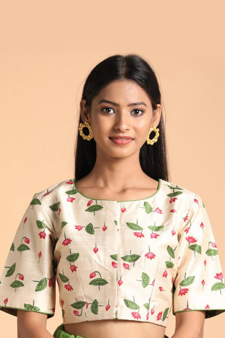 Beige coloured Pichwai printed blouse crafted from luxurious raw silk fabric.