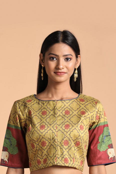 Mustard coloured Pichwai printed blouse crafted from luxurious raw silk fabric.