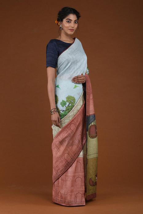 A handwoven tussar linen fabric saree in sky blue & brick red colour