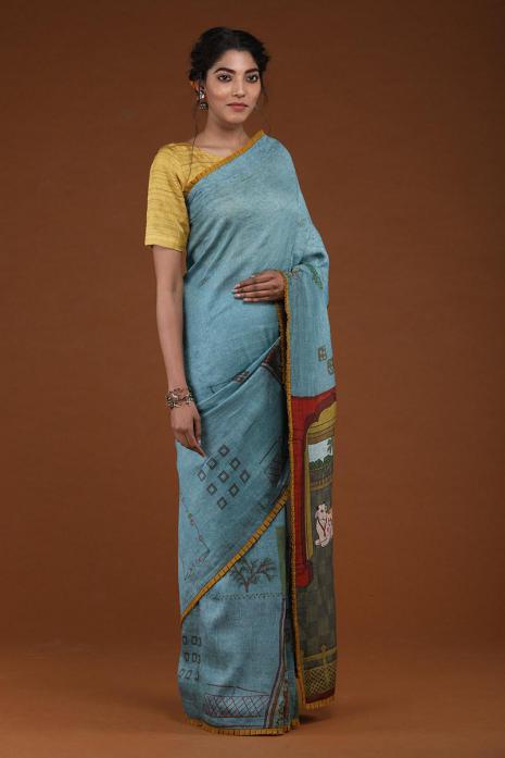A handwoven tussar linen fabric saree in light blue colour 