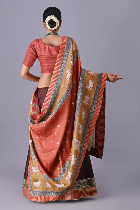 Colorful party wear rust dupattas with intricate pichwai prints and embroidery