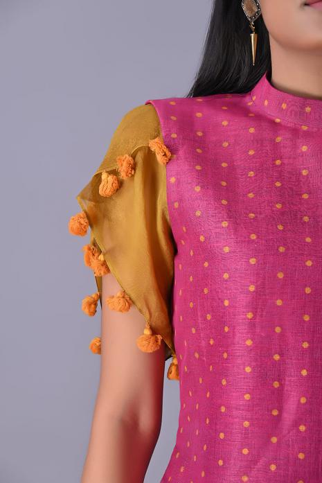 Fuchsia coloured Tussar linen tunics with printed Pichwai motifs and elegant organza sleeves.