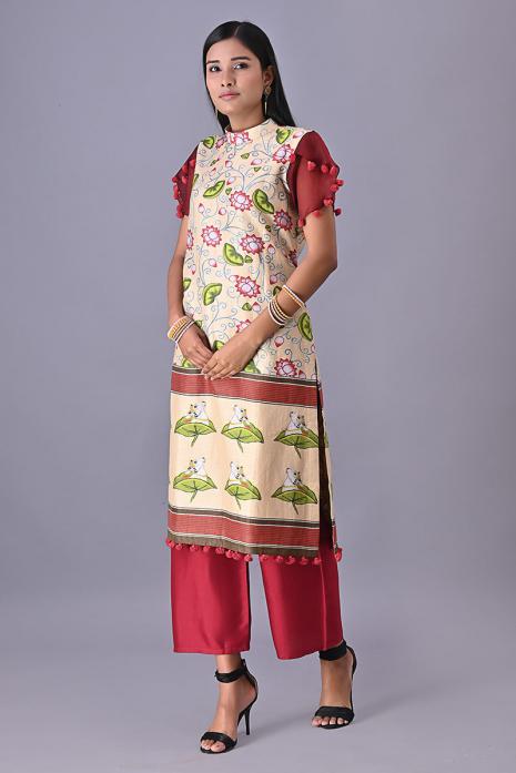 Cream coloured Tussar linen tunics with printed Pichwai motifs and elegant organza sleeves.