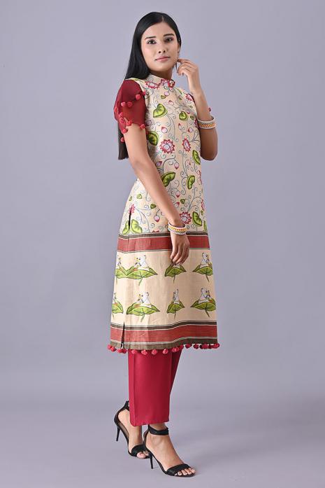 Cream coloured Tussar linen tunics with printed Pichwai motifs and elegant organza sleeves.