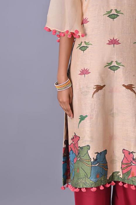 Light Peach coloured Tussar linen tunics with printed Pichwai motifs and elegant organza sleeves.