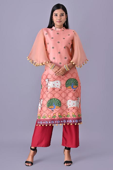 Pink coloured Tussar linen tunics with printed Pichwai motifs and elegant organza sleeves.