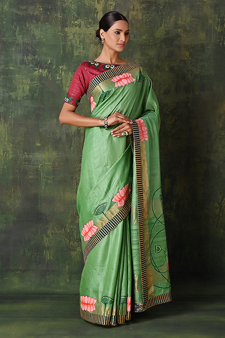 A vibrant collection of green handcrafted sarees
