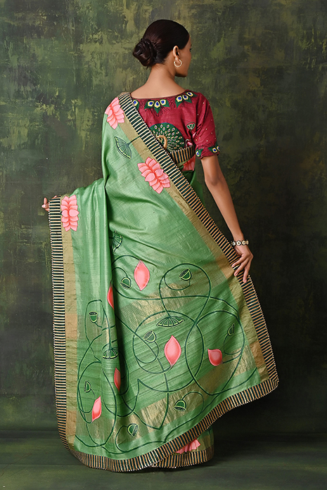 A vibrant collection of green handcrafted sarees
