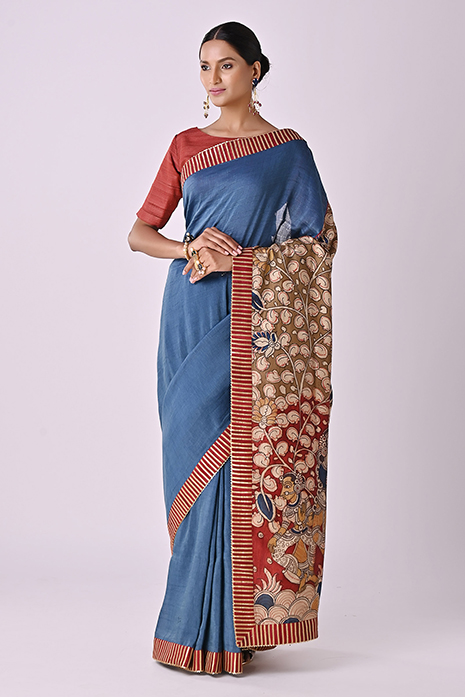 A vibrant collection of blue coloured handcrafted sarees with intricate Kalamkari artistry