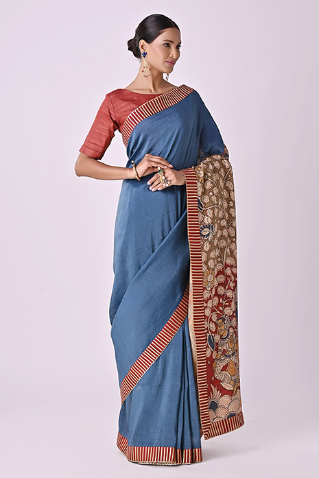 A vibrant collection of blue coloured handcrafted sarees with intricate Kalamkari artistry