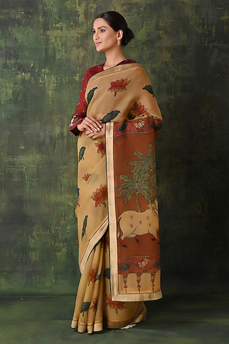A vibrant collection of pale yellow handcrafted sarees with intricate Kalamkari artistry