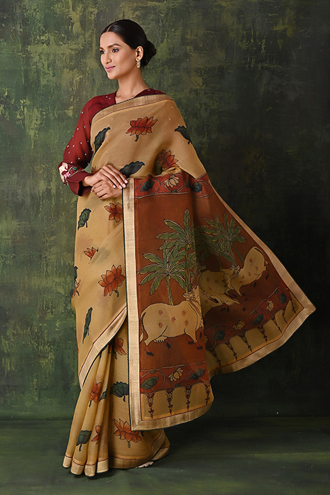 A vibrant collection of pale yellow handcrafted sarees with intricate Kalamkari artistry