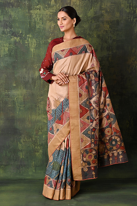 A vibrant collection of multi coloured handcrafted sarees with intricate Kalamkari artistry