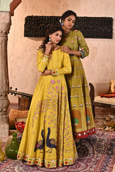 A beautiful print and hand-embroidered gown in yellow colour