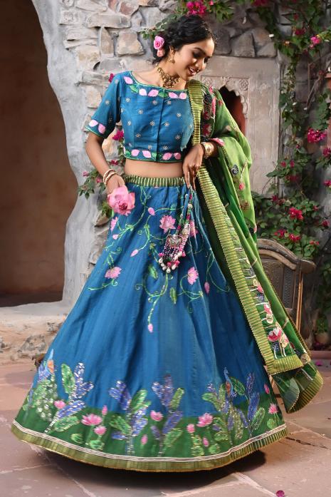 A beautiful hand-painted and hand-embroidered lehenga set in blue colour