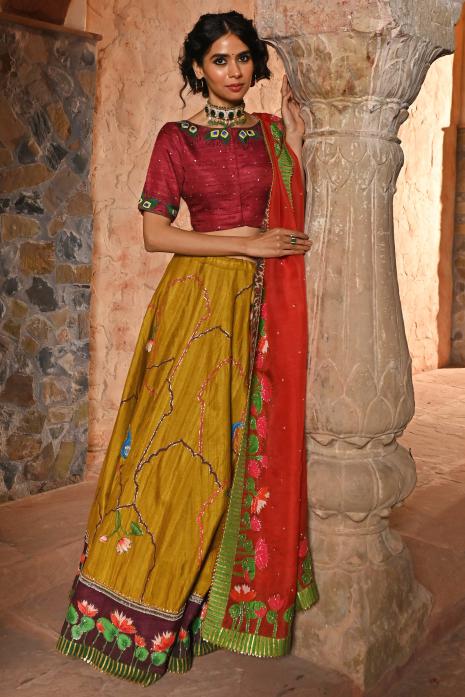 A beautiful hand-painted and hand-embroidered lehenga set in mustard colour 