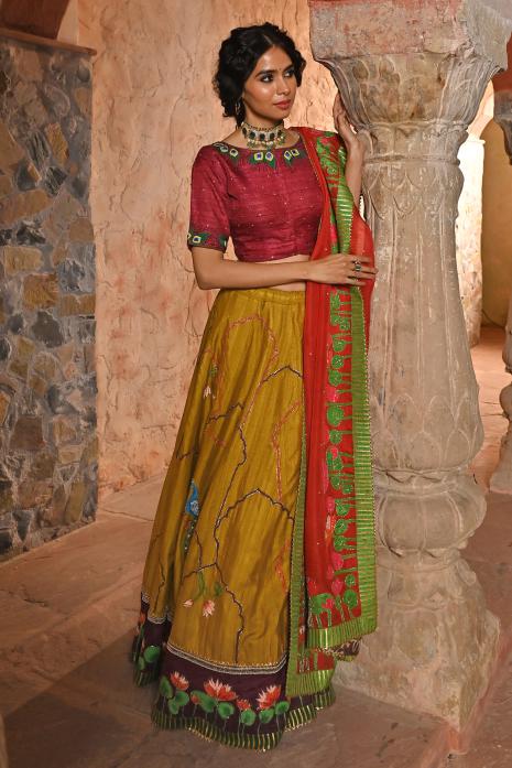 A beautiful hand-painted and hand-embroidered lehenga set in mustard colour 