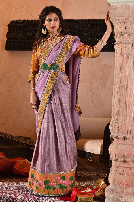 A beautiful hand-painted and hand-embroidered lehenga set in mauve colour 