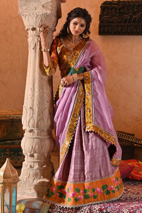 A beautiful hand-painted and hand-embroidered lehenga set in mauve colour 