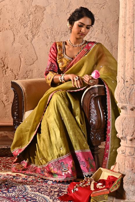 A beautiful hand-painted and hand-embroidered lehenga set in olive colour 