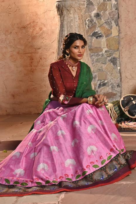 A beautiful hand-painted and hand-embroidered lehenga set in pink colour 