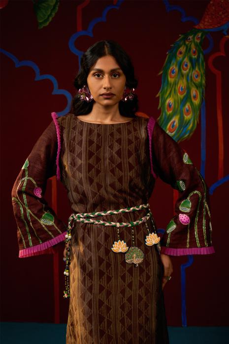 Brown coloured hand-painted Pichwai tunics on organza, ghicha silk & chanderi,  featuring intricate traditional Pichwai artistry and vibrant colors.