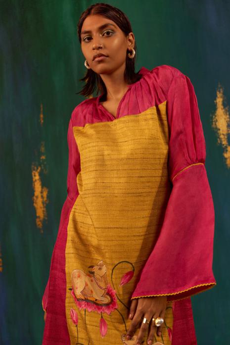 Yellow & Pink coloured hand-painted Pichwai tunics on organza, ghicha silk & chanderi, featuring intricate traditional Pichwai artistry and vibrant colors.
