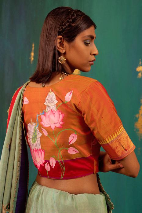 Mustard coloured Pichwai handpainted blouse crafted from luxurious paithani silk fabric.