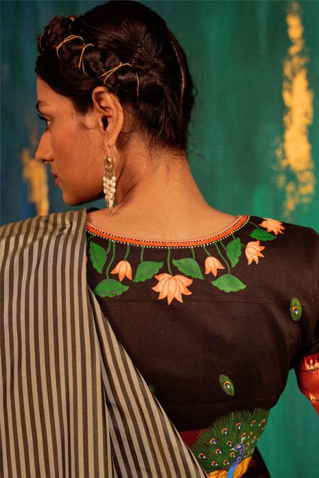 Black coloured Pichwai handpainted blouse crafted from luxurious paithani silk fabric.