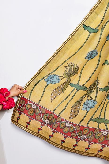 Tussar Linen lemon coloured kalamkari dupatta with intricate hand-painted Pichwai art designs and vibrant colors.
