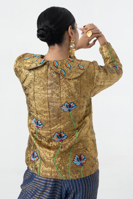 An elegant co-ord set in golden and blue hues, embellished with Pichwai embroidery