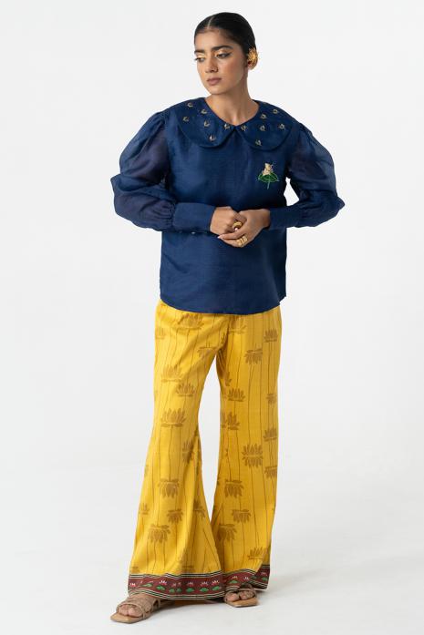 Yellow coloured print Pichwai pants featuring intricate Pichwai motifs in vibrant colours.