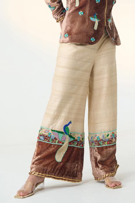Brown and Beige coloured print Pichwai pants featuring intricate Pichwai motifs in vibrant colours.