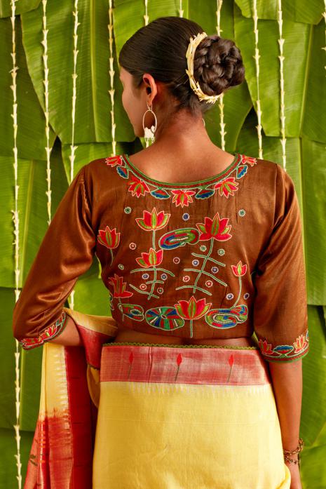 Brown coloured Pichwai embroidered blouse crafted from mashru silk fabric.
