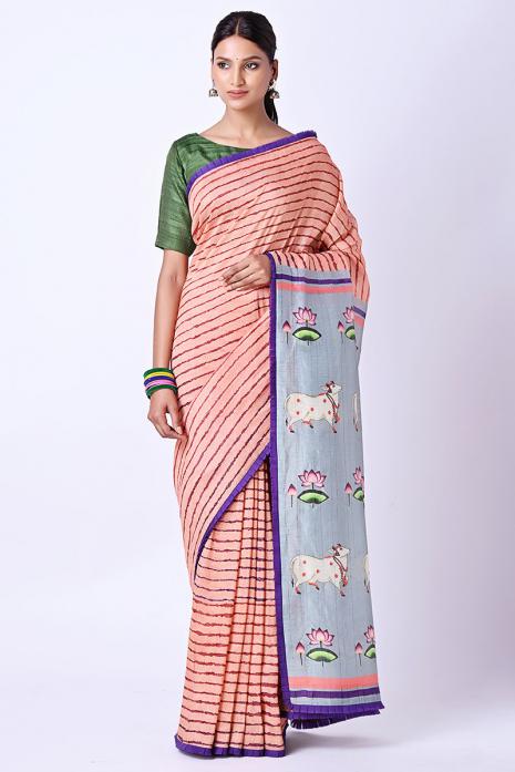 A handwoven tussar linen fabric saree in pink colour with a beautiful intricate print featuring traditional Pichwai motifs.