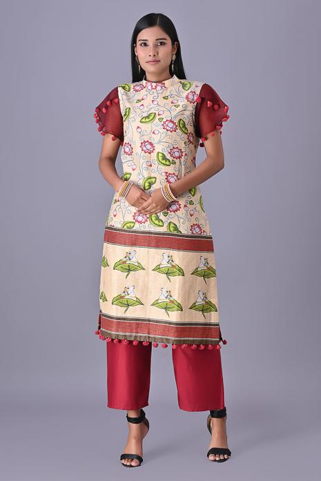 Cream coloured Tussar linen tunics with printed Pichwai motifs and elegant organza sleeves.