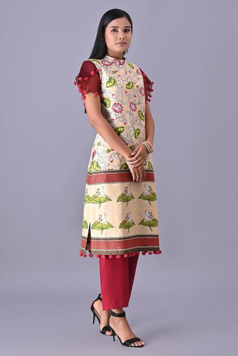 Cream coloured Tussar linen tunics with printed Pichwai motifs and elegant organza sleeves.