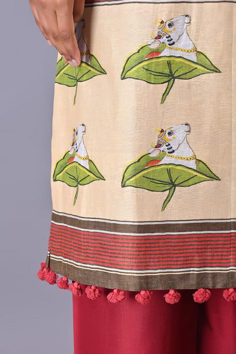 Cream coloured Tussar linen tunics with printed Pichwai motifs and elegant organza sleeves.