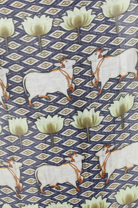 A handwoven tussar linen fabric saree in blue colour with a beautiful intricate print featuring traditional Pichwai motifs.