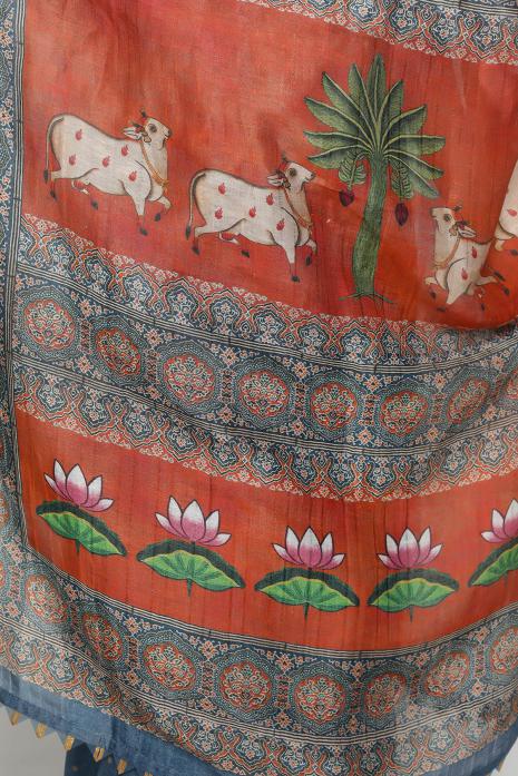 A handwoven tussar linen fabric saree in blue colour with a beautiful intricate print featuring traditional Pichwai motifs.