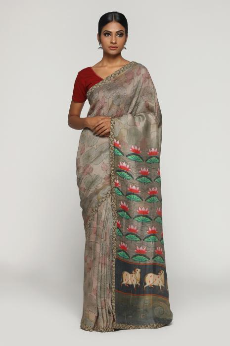 A handwoven tussar linen fabric saree in grey colour with a beautiful intricate print featuring traditional Pichwai motifs.
