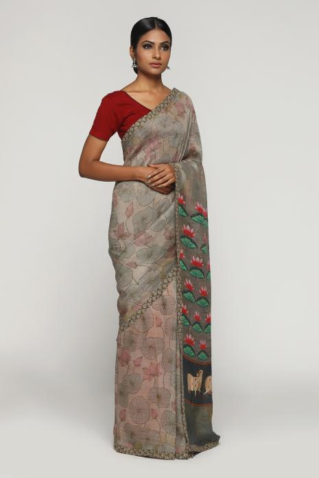 A handwoven tussar linen fabric saree in grey colour with a beautiful intricate print featuring traditional Pichwai motifs.