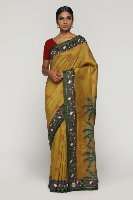 A handwoven tussar linen fabric saree in mustard colour with a beautiful intricate print featuring traditional Pichwai motifs.