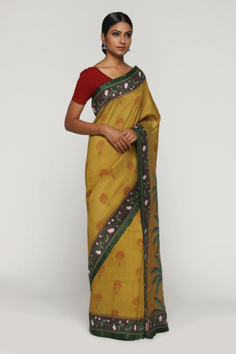 A handwoven tussar linen fabric saree in mustard colour with a beautiful intricate print featuring traditional Pichwai motifs.