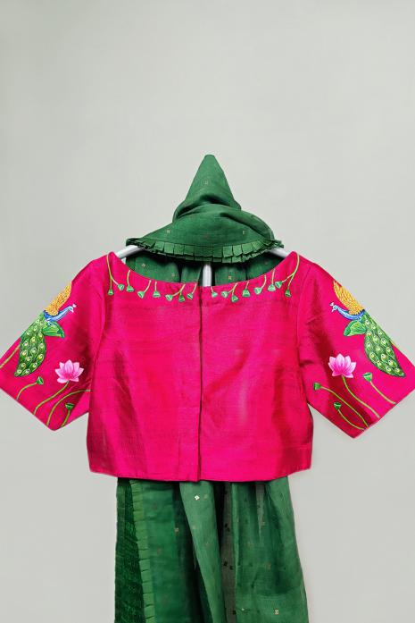 Dark Pink coloured Pichwai hand handpainted blouse crafted from luxurious Raw silk fabric.