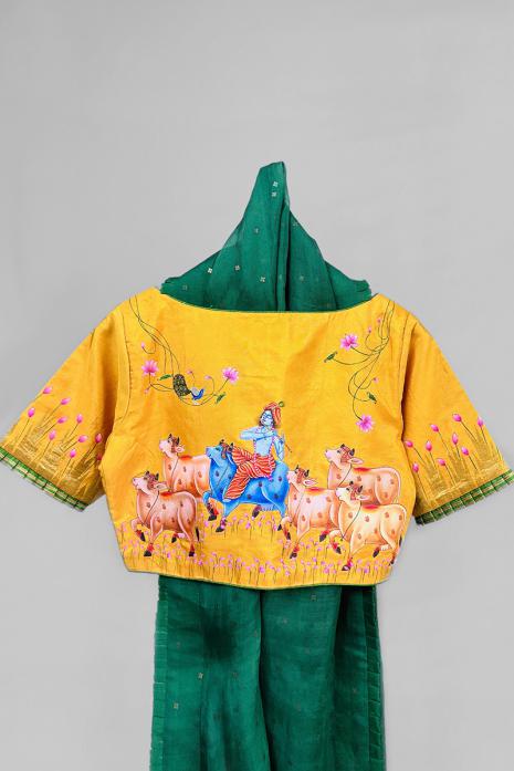 Yellow coloured Pichwai hand handpainted blouse crafted from luxurious kanjeeveram silk fabric.