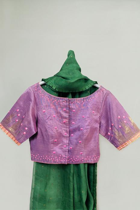 Mauve coloured Pichwai hand handpainted blouse crafted from luxurious kanjeeveram silk fabric.