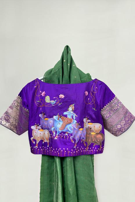 Dark Purple coloured Pichwai hand handpainted blouse crafted from luxurious banaras silk fabric.