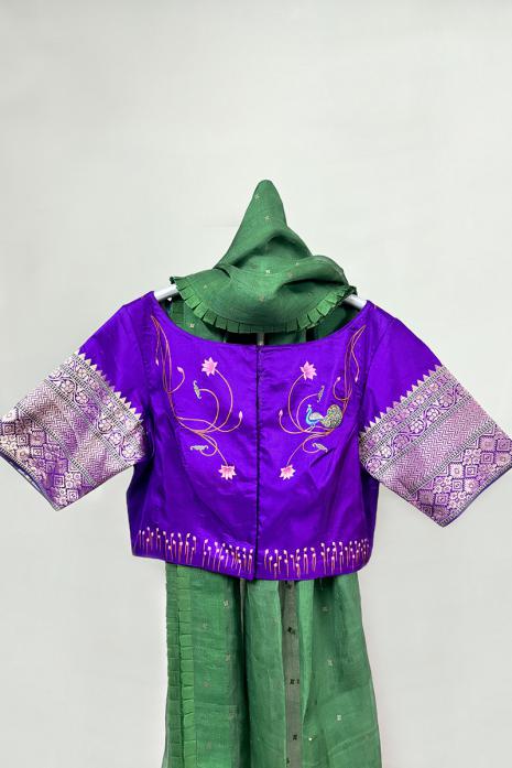 Dark Purple coloured Pichwai hand handpainted blouse crafted from luxurious banaras silk fabric.