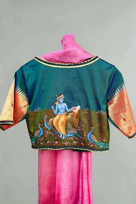 Teal blue coloured Pichwai hand handpainted blouse crafted from luxurious paithani silk fabric.